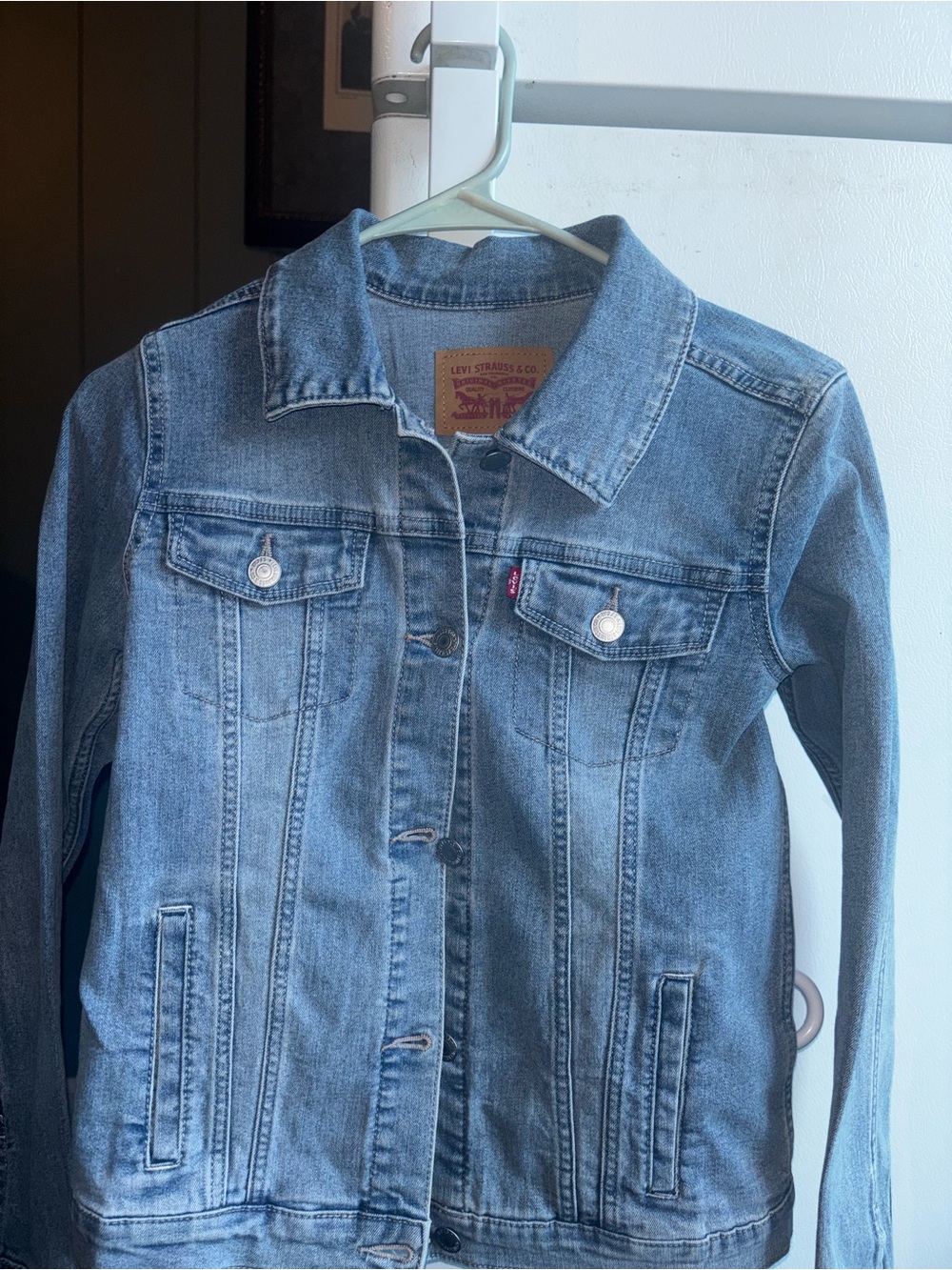 Girls Leviâs denim trucker jacket.